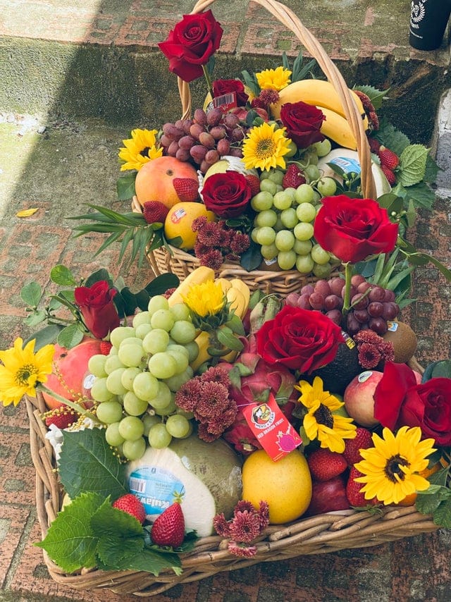 One seasoning choice fruit and flower arrangement in bamboo basket