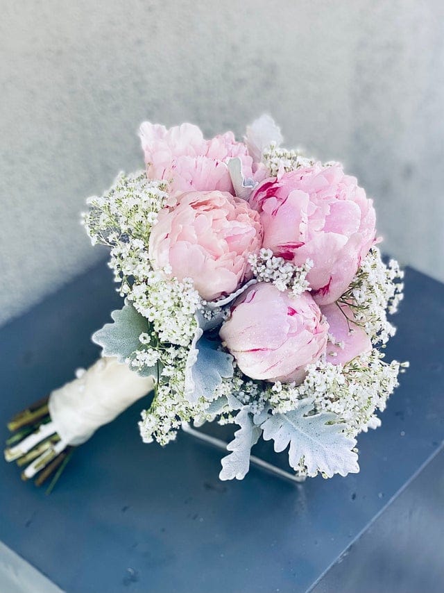 Peony and baby’s breath bridal bouquet