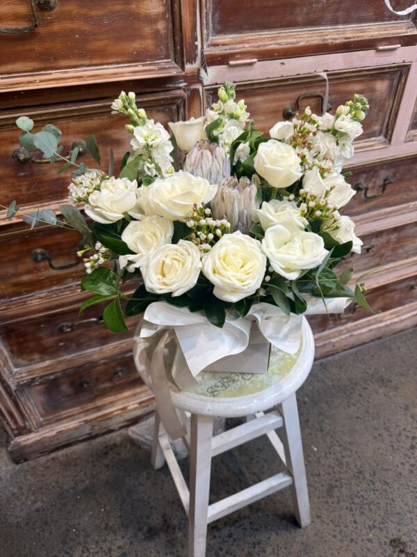 Floral Arrangement with Protea hand-arranged by Hamblins Florist
