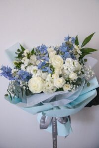 Blue angel bouquet hand-arranged by Hamblins Florist