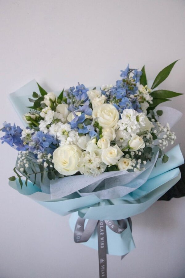 Blue angel bouquet hand-arranged by Hamblins Florist